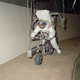 You can’t crouch with a space-inflated space suit, hence the riding position. Dig the ‘60s robin’s egg blue. Photo Credit: NASA